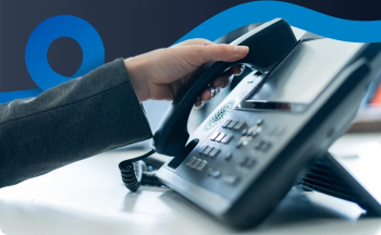 Phone with hand resized | Vox | Your Company’s Telephony Needs: the Right Choice